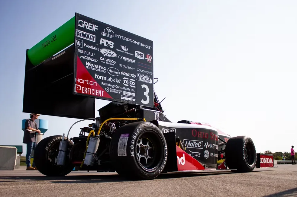 Rear view of the Formula Buckeyes race car showing the InterProWebHost logo prominently on the sponsor board