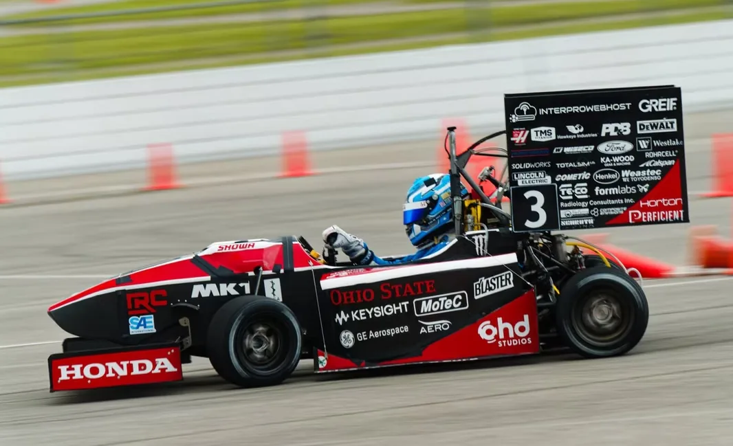 Formula Buckeyes race car driving on track with the InterProWebHost sponsor mark visible